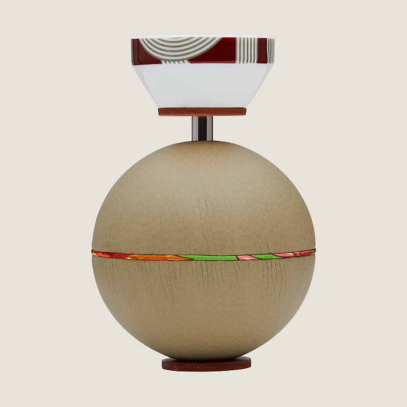 Spherical music box with a porcelain key | Hermès USA